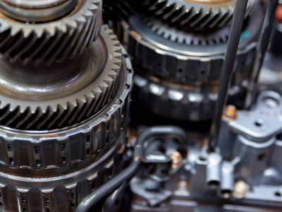 Planetary gearsets inside vehicle automatic transmission. Close up view in mechanic workshop during repairing